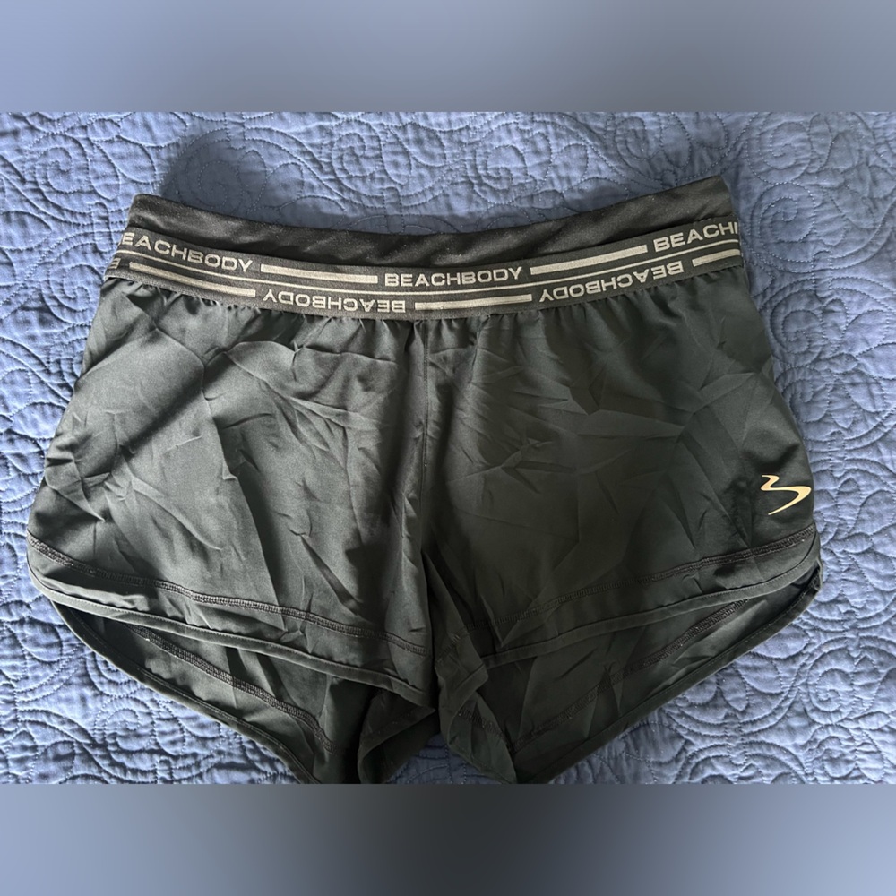 Size large black Beachbody brand athletic shorts.